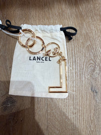 Porte-clés dore lancel 02/06
