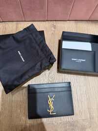 Yves Saint Laurent noir cuir 30/06