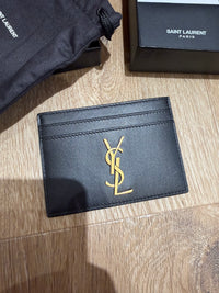 Yves Saint Laurent noir cuir 30/06