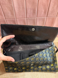 Pochette noire et dorée Prada 24/06