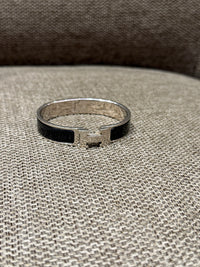 Bracelet noir Clic Hermès, finition argentée 19/10