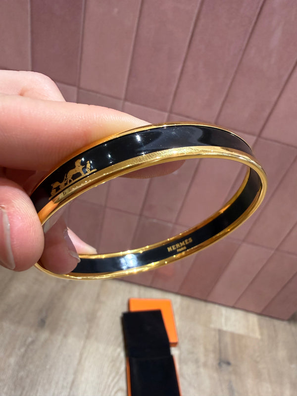 Bracelet jonc hermès doré et noir 23/06