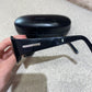 Lunettes de soleil Prada