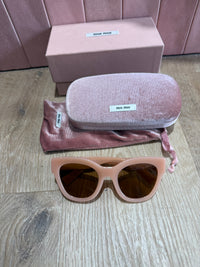 Lunettes de soleil miumiu